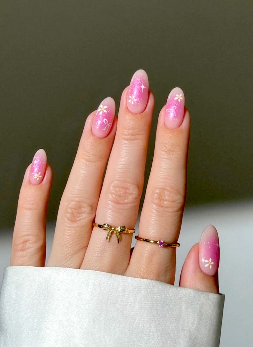 Soft, pink manicure featuring white floral