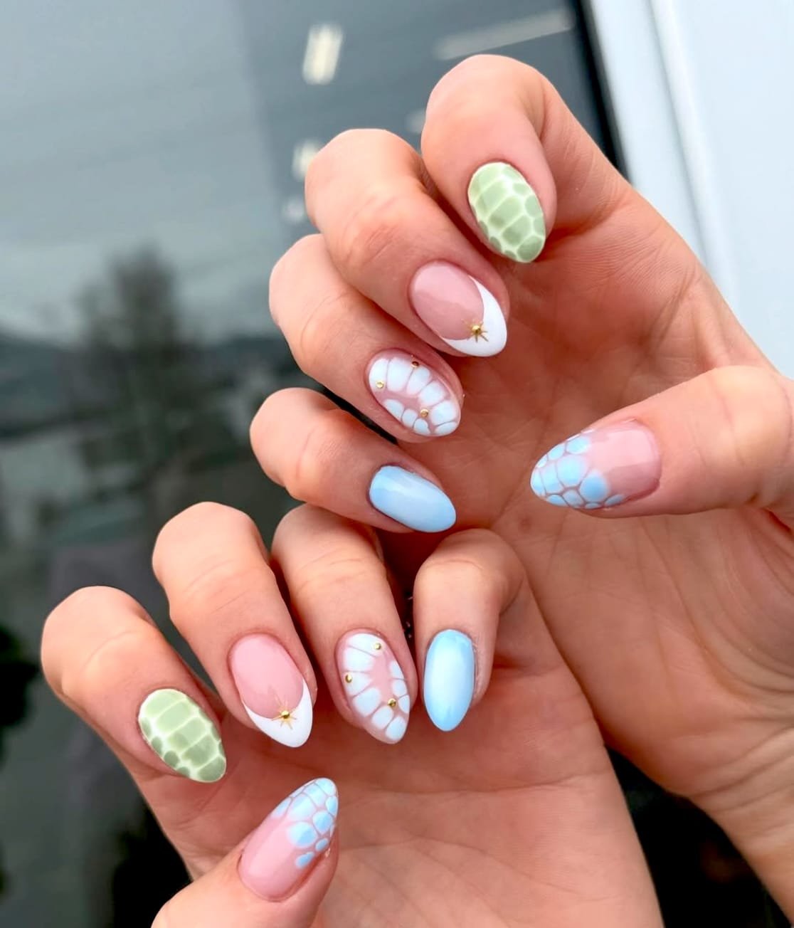 Delicate and whimsical spring-themed nails